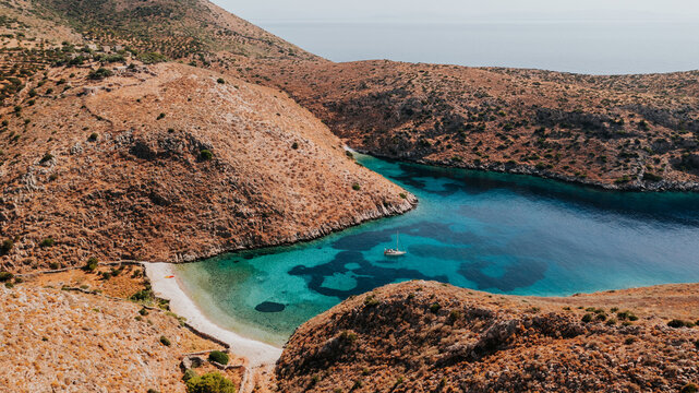 Remote Mediterranean Cove with Turquoise Water and Rugged Hills