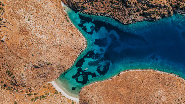 Turquoise Bay and Rocky Peninsula from Above in the Greek Island