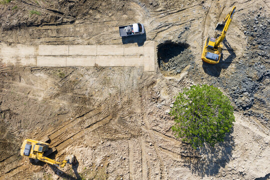 Aerial View of Construction Site with Excavators and Dirt