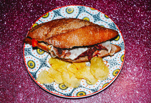 high angle view of a cheese burger on a plate