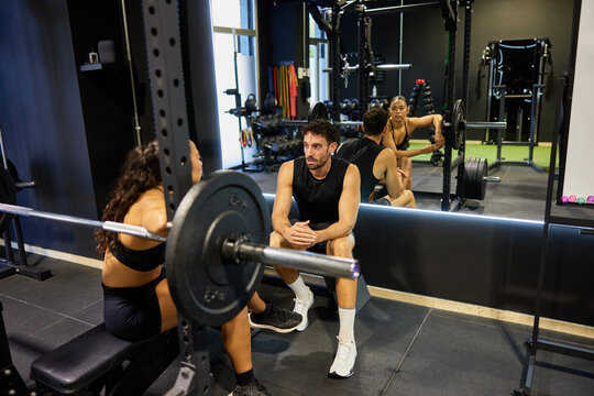 Gym workout session with two people in fitness area