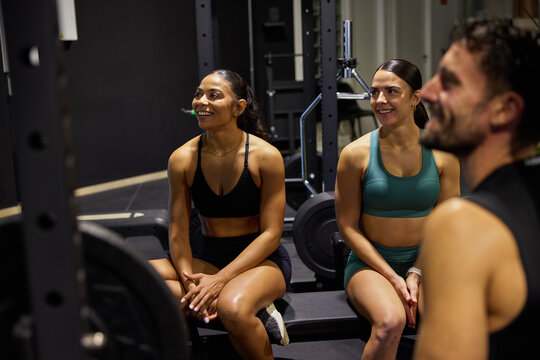 Group enjoys workout time in gym during fitness session