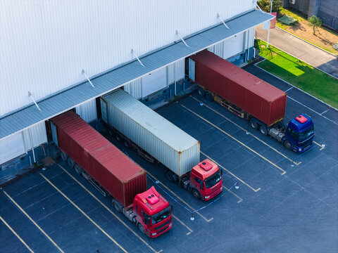 Aerial view of container trucks at factory
