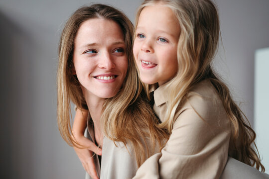 Joyful Moments Shared Between a Mother and Daughter in a Cozy Room