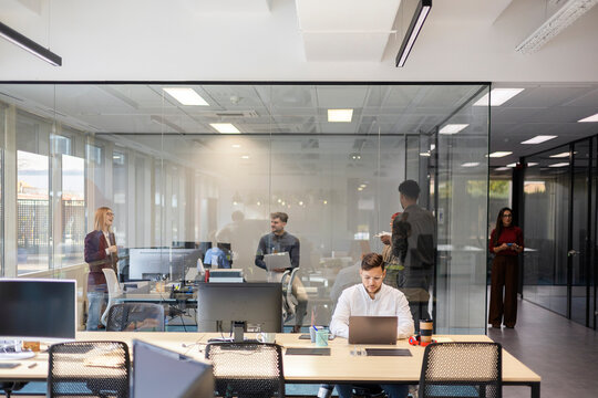 Diverse startup business colleagues working in modern office