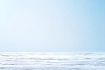 Fototapeta premium Gentle Snowfall in Arctic Landscape with Open Space and Soft Blue Sky