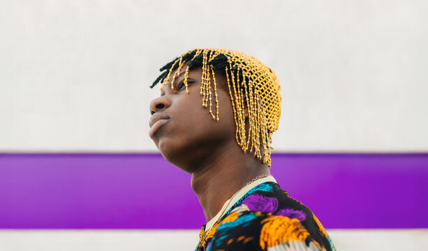 Upward gaze of man in traditional bead headwear