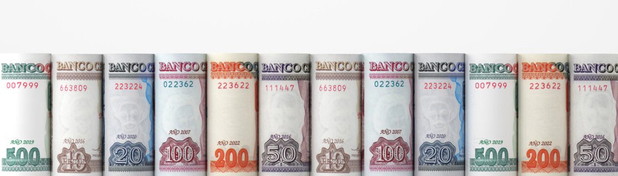 Cuban peso banknotes rolled in a row isolated on white background