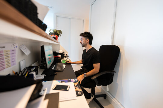 Veterinarian working on computer in veterinary hospital office