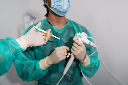 Veterinarians performing endoscope procedure in hospital