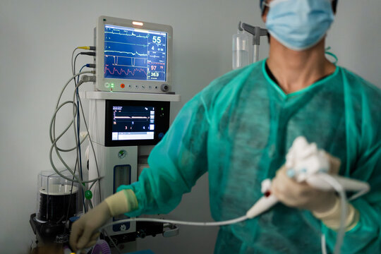 Veterinarian performing surgery in animal hospital operating room