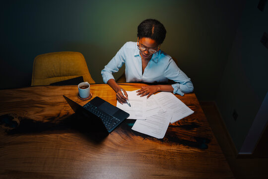 Working late at night with papers
