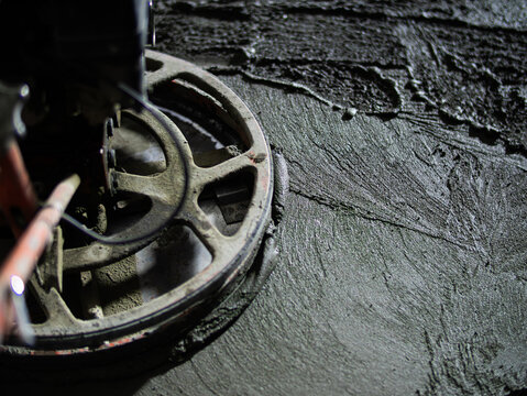 Concrete floor polishing machine in parking garage