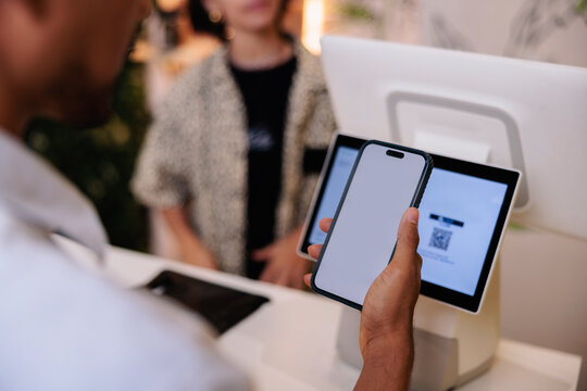 Paying with phone at point of sale system.