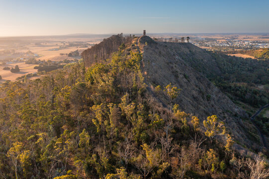 Road up to a castle like lookout tower on top of a high ridge line