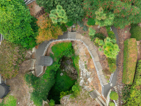 Steps leading down to viewing platform above a cave entrance