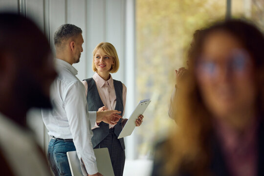 Associates talking in the hallway