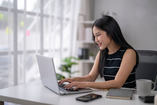 Woman engaging in remote work at home office