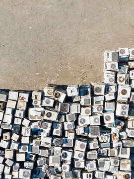 Discarded Air Conditioner Units Piled at Recycling Yard