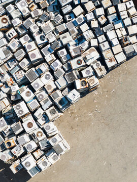 Discarded Air Conditioner Units Piled at Recycling Yard
