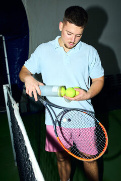 Man prepares for a game of tennis