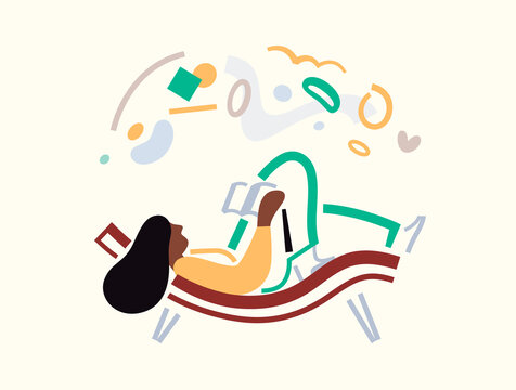 Woman reading a book relaxing on lounge chair