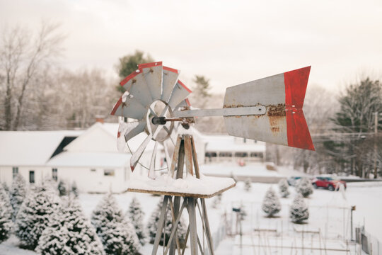 vintage windmill showing direction of wind in winter 