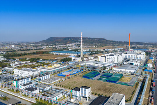 Aerial View of Large Industrial Plant with Smokestacks

