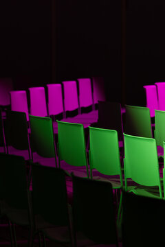 Colorful chairs in dimly lit room