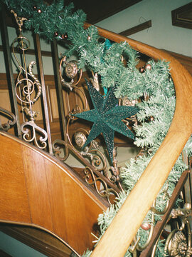 Decorative Staircase With Garland and Star at Holiday Time