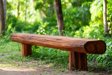 Fototapeta premium Fallen Tree Transformed into Natural Bench for Outdoor Relaxation in Lush Green Setting