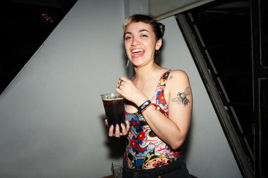 Flash portrait of woman enjoying nightlife moment