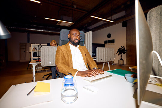 Man focused on his work at his computer