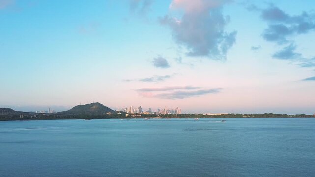 A beautiful blue ocean with a city skyline in the background