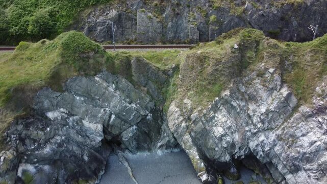 Aerial perspective of railway tracks on a cliff edge.