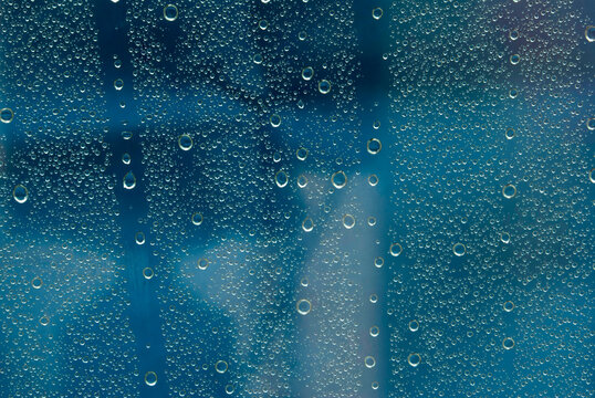 Closeup macro raindrops abstract patterns windshield after rainstorm