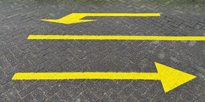 road with yellow arrows
