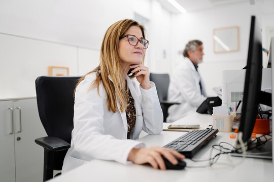 Female doctor working on computer in medical office