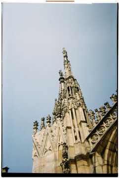 the spires of the Duomo di Milano, Italy, seen from below, 35mm film