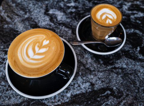 Barista Prepares Latte and Cappuccino in Cafe Setting
