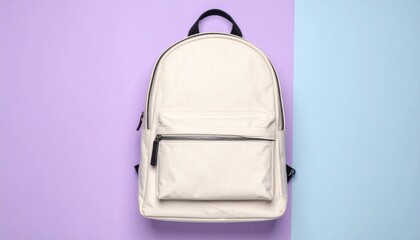 Fototapeta premium White minimalist backpack with a front pocket, centered on a split background of purple and light blue.