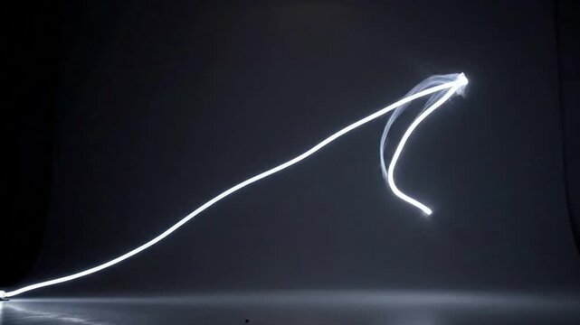 Ethereal Glow from Static Fixtures A high-angle or wide shot of a modern, non-descript ceiling light fixture (e.g., recessed lights, abstract installation) captured with long exposure, showcasing its