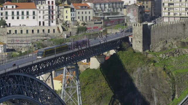 Profile view of the bridge crossing the Douro River towards Ribeira.
