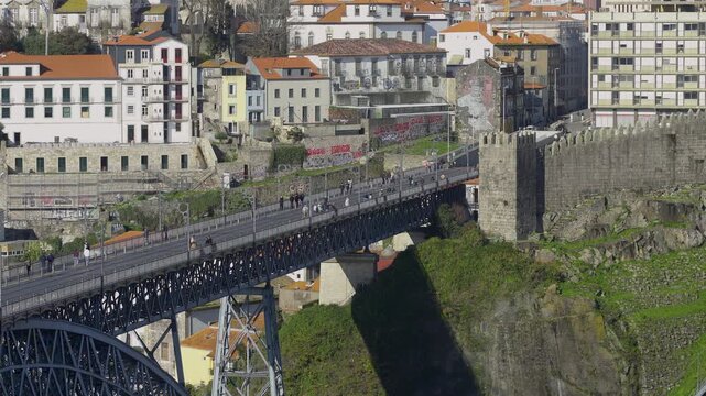 Side view of the iron bridge highlighting the structure and the cliffside.
