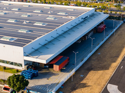 Solar-Powered Factory with Logistics Trucks