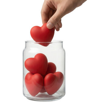Hand placing red heart in clear glass jar donation concept on white background