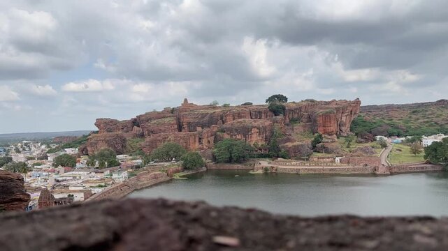 Beautiful time-lapse of the mountain range surrounding Agastya Lake, capturing the calm waters and scenic beauty of Badami Lake in a serene and timeless landscape