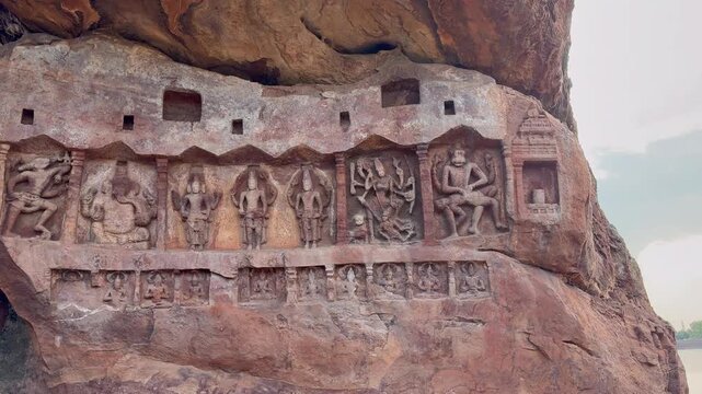 A beautiful Dashavatara carved in red sandstone at Badami, depicting the ten incarnations of Lord Vishnu with fine detailing and graceful form