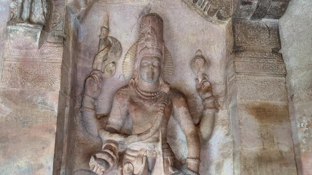 Ananta (Reclining) Vishnu carved in stone at Badami Cave Temple No. 3, showing Lord Vishnu resting on the cosmic serpent Shesha, symbolizing cosmic balance and creation