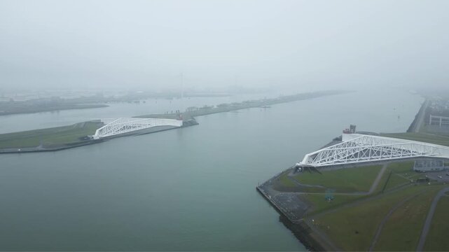 Aerial view of the Maeslantkering protecting Rotterdam harbor and inland Netherlands from North Sea storm surge flooding.